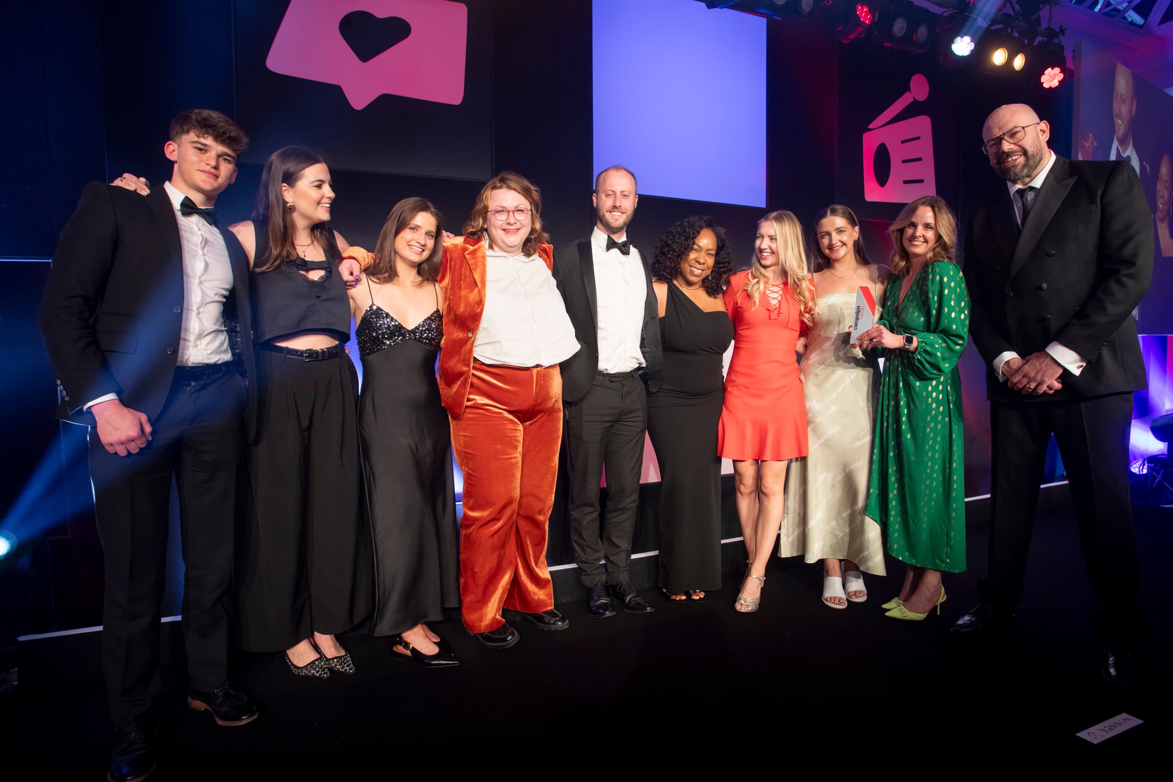 iProspect UK team holding Campaign Media Award on stage