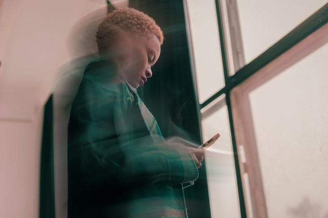 woman looking at phone