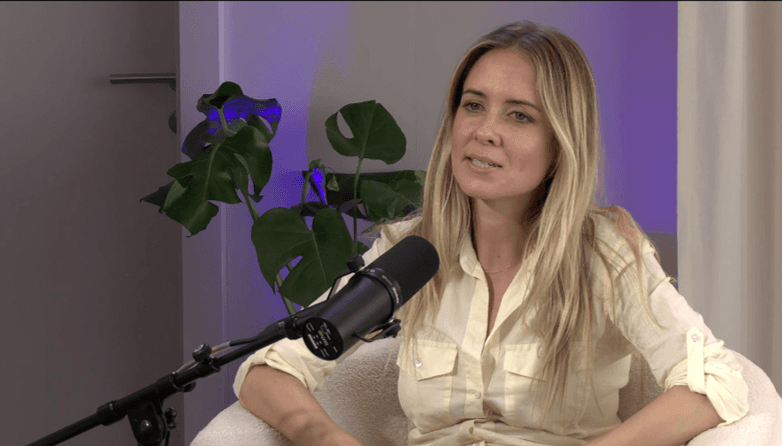 image of a woman speaking into a microphone