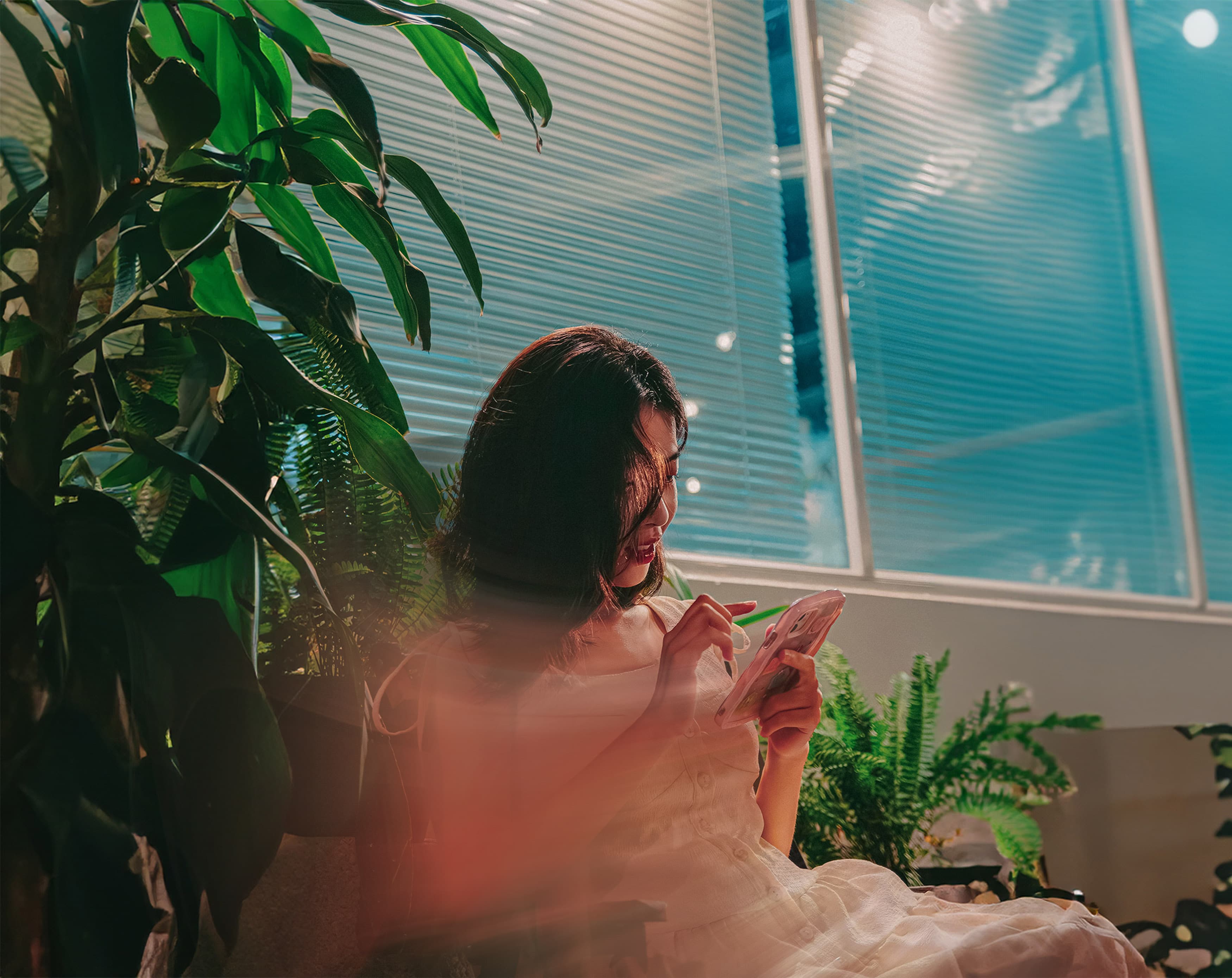 image of woman looking at her phone