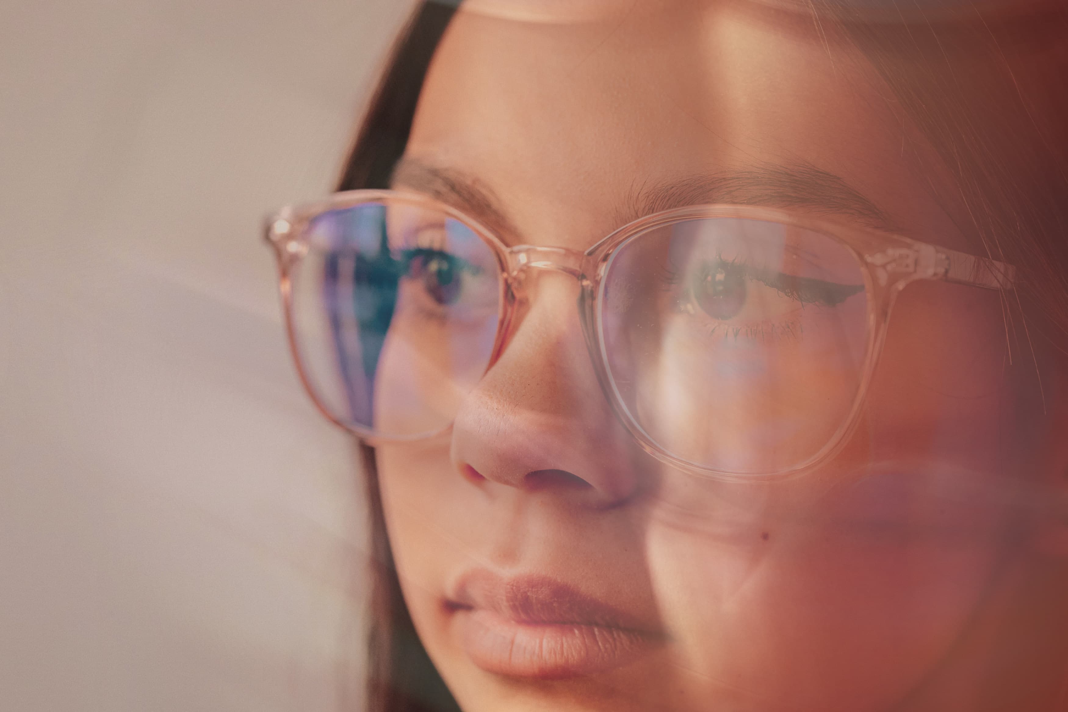woman looking to the side with glasses on