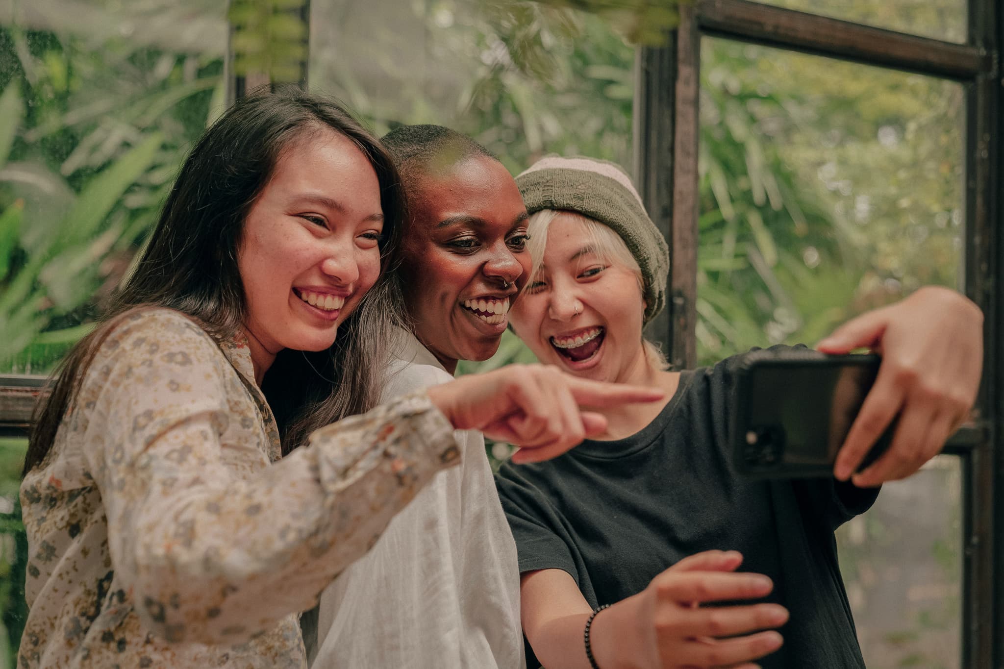 Image of Three Women Laughing and Taking a Selfie