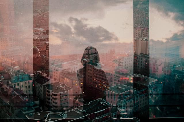 woman looking onto cityscape