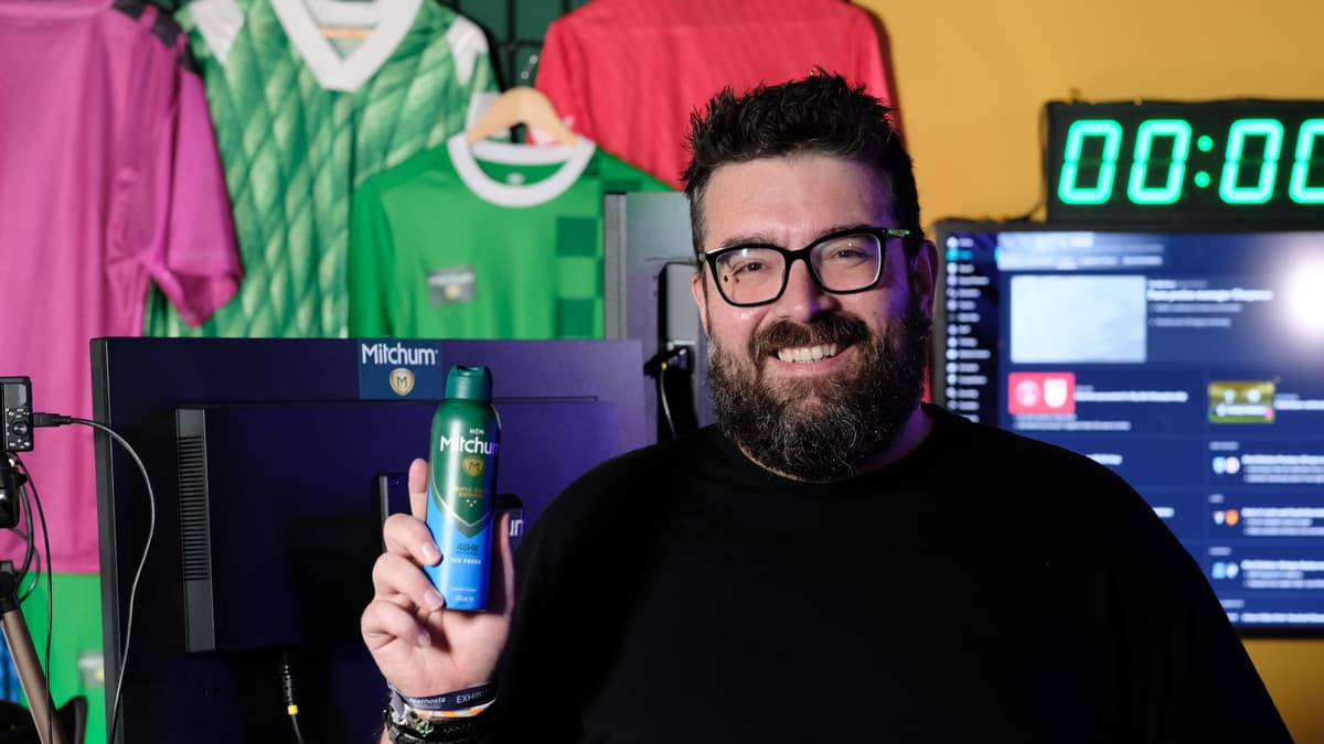 Streamer Kevin Chapman holding Mitchum deodorant during live gaming challenge