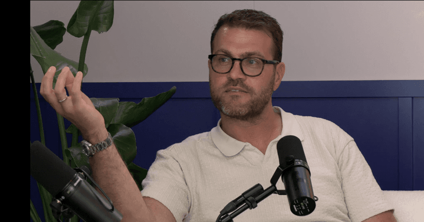 image of a man speaking into a microphone