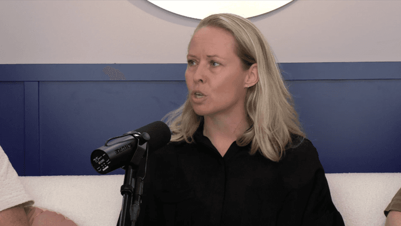 image of a woman speaking into a microphone