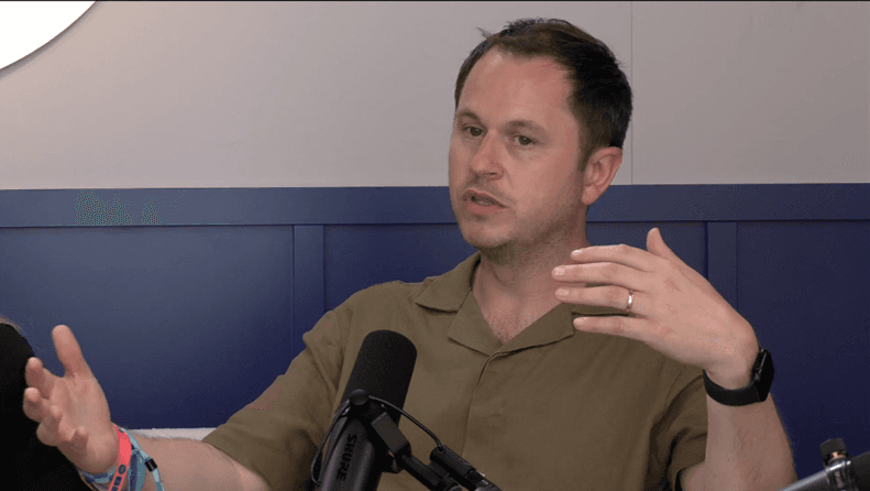 image of a man speaking into a microphone
