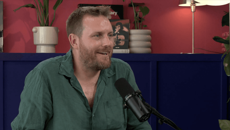 image of a man speaking into a microphone