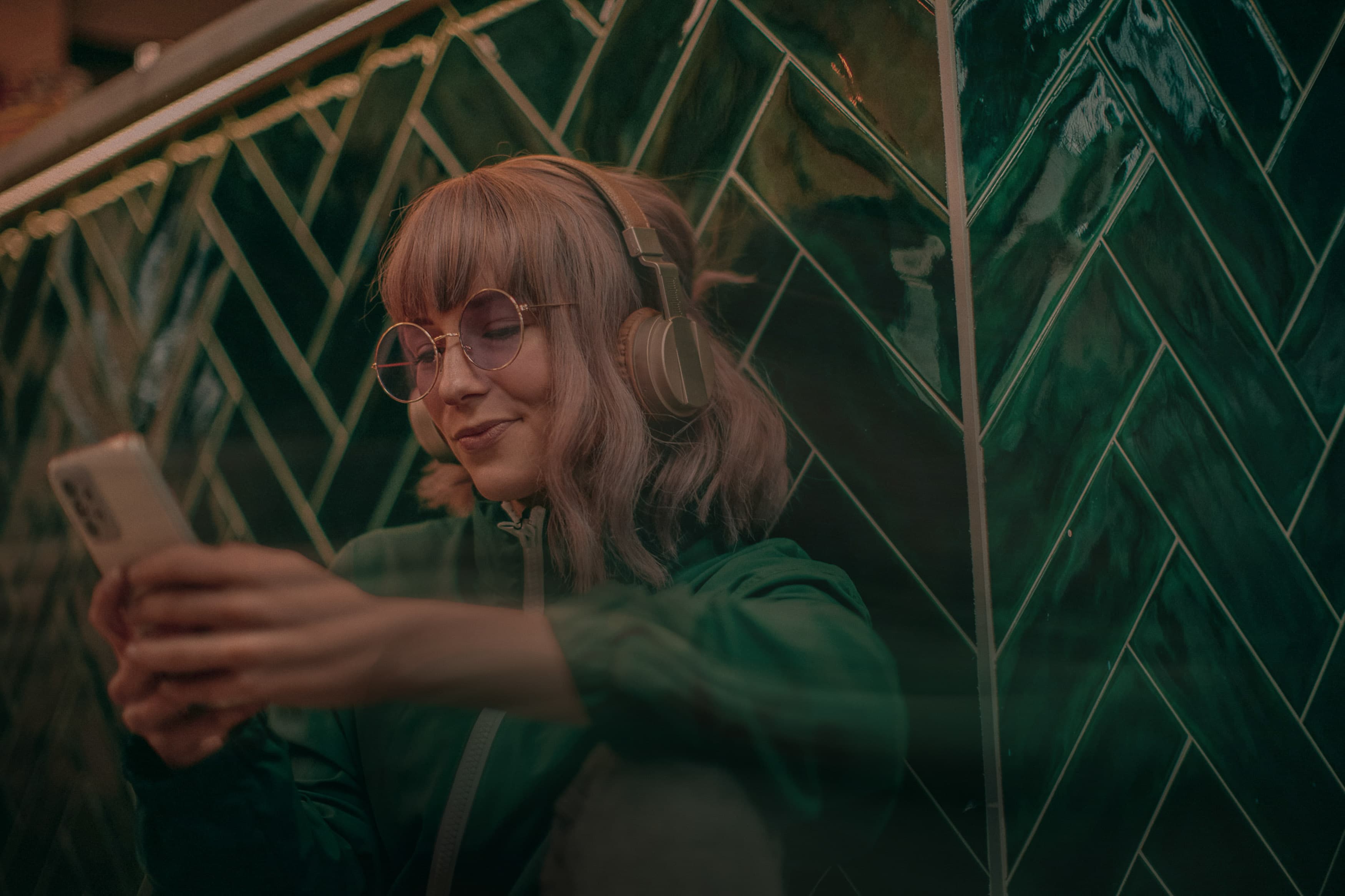 image of girl with glasses on looking at phone iprospect culture accelerated
