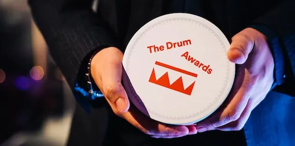 an image of the drum awards trophy being held